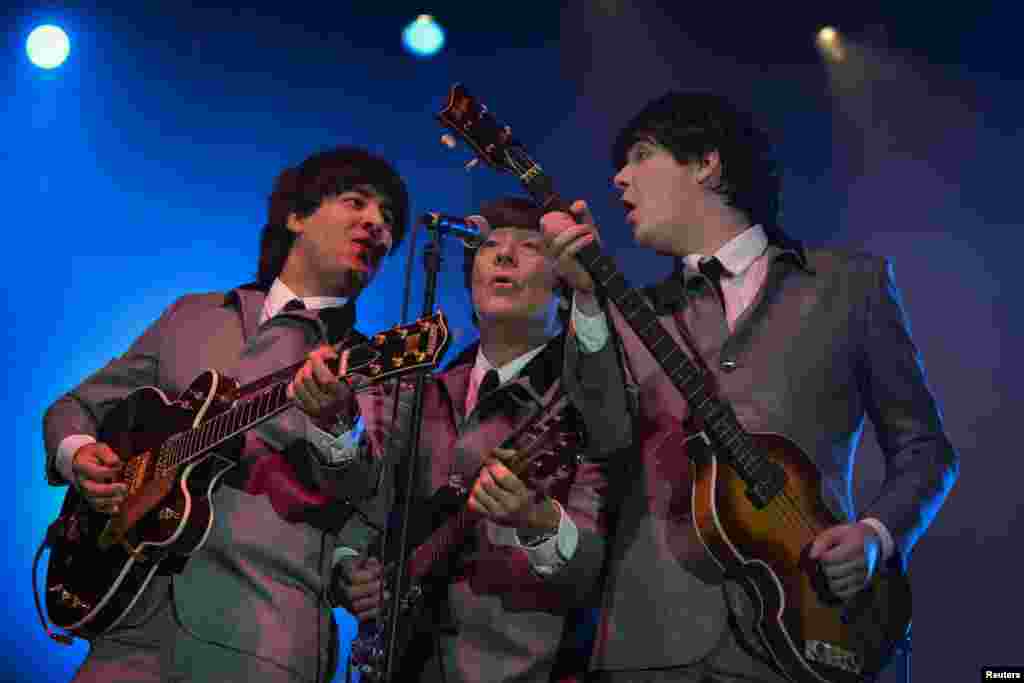 A Beatles tribute band plays at the dilapidated Washington Coliseum on the 50th anniversary of The Beatles' first North American performance at the venue in Washington, Feb. 11, 2014.
