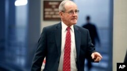 FILE - Sen. Jim Risch, R-Idaho, arrives for a vote on Capitol Hill, May 17, 2018, in Washington.