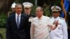 U.S. President Barack Obama, left, walks with Philippines President Benigno Aquino III at Malacanang Palace in Manila, the Philippines, April 28, 2014. 