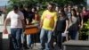 Friends and relatives carry the coffin with the body of Vale SA employee Janice Helena do Nascimento, victim of the collapsed dam, during her burial in Brumadinho, Brazil, Jan. 29, 2019.