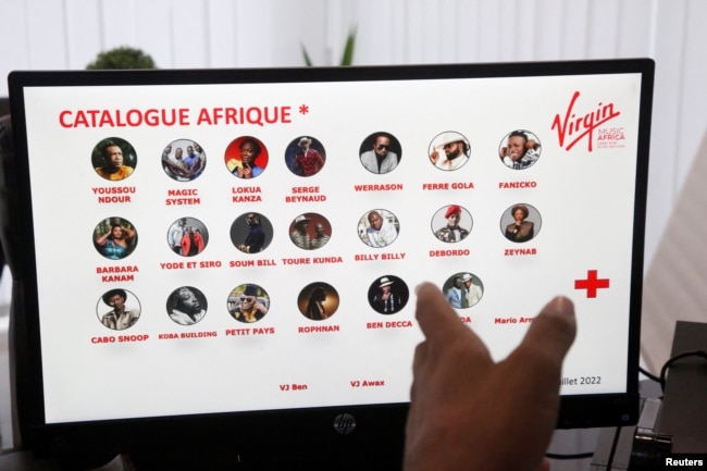 Franck-Alcide Kacou, Managing Director of Universal Music Africa and Virgin Music Label & Artist Services in Africa, displays the Virgin Music Africa's African catalog on a computer screen in his office in Abidjan, Ivory Coast June 29, 2022. (REUTERS/Luc Gnago)