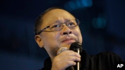 FILE - Founder of the Occupy Central civil disobedience movement Benny Tai cries during a rally outside government headquarters after protesters were threatened by residents and pro-Beijing supporters in Kowloon's crowded Mong Kok district.