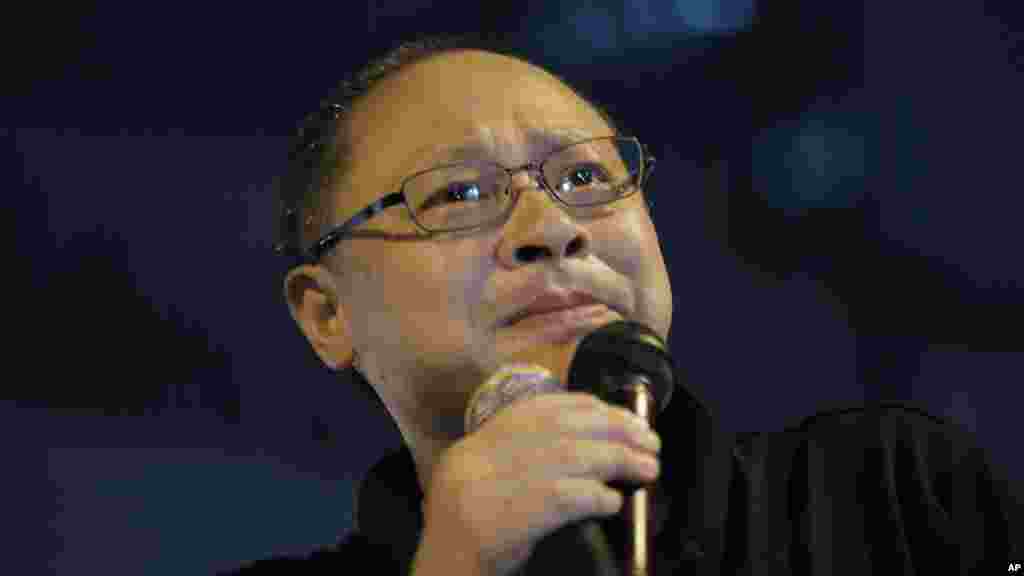 FILE - Founder of the Occupy Central civil disobedience movement Benny Tai cries during a rally outside government headquarters after protesters were threatened by residents and pro-Beijing supporters in Kowloon's crowded Mong Kok district.