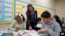 A tutor helps students at Benjamin O. Davis Middle School in Compton, California, Feb. 6, 2025.