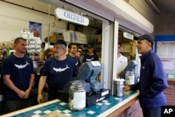 U.S. President Barack Obama orders lunch at Nancy's restaurant in 2013.