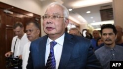 FILE - Malaysia's former prime minister Najib Razak arrives at the Kuala Lumpur High Court for his trial over 1MDB corruption allegations in Kuala Lumpur on August 19, 2019.