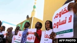 FILE - Sudanese journalists protest against restrictions on media freedom, at the headquarters of the National Council for Press and Publications, in Sudan's capital Khartoum, Nov. 15, 2017.