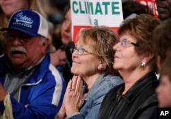 Audience members listen to former Vice President and Democratic presidential candidate Joe Biden speak during a rally, May 1, 2019, in Des Moines, Iowa.