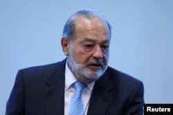 FILE - Mexican billionaire Carlos Slim speaks during a news conference in Mexico City, Mexico.
