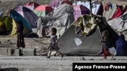 FILE - Internally displaced Afghan children play at the Saray Shamali IDP camp in Kabul, Afghanistan, Nov. 2, 2021. 