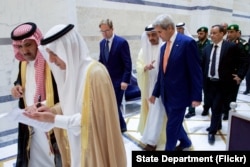 U.S. Secretary of State John Kerry walks with United Kingdom Under Secretary of Foreign Affairs Tobias Ellwood and United Arab Emirates Foreign Minister Abdullah bin Zayed on August 25, 2016, in the Royal Terminal 1 at King Abdulaziz International Airport.