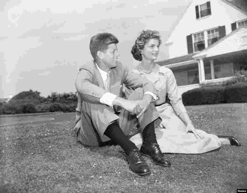 Sen. John F. Kennedy, D-Mass., and his fiancee Jacqueline Bouvier, 23, pose on the lawn of the Kennedy residence during their weekend visit at Hyannis, Ma., on June 27, 1953. The couple announced their engagement June 23. (AP Photo)