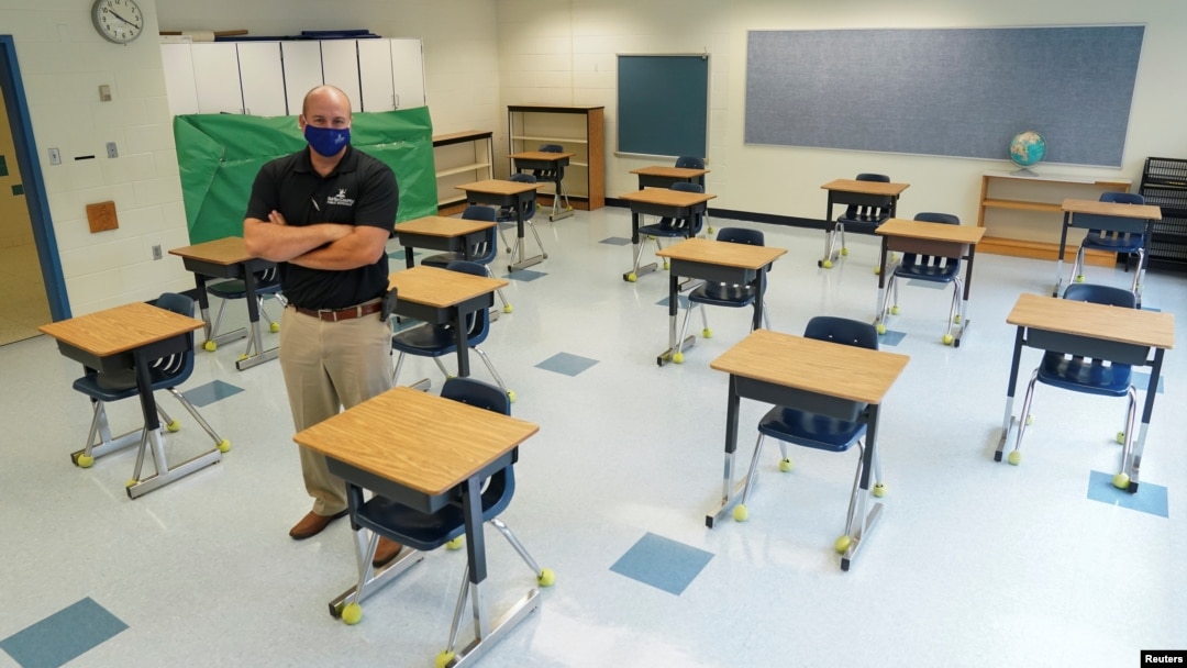 Fairfax County Public Schools assistant director of facilities management Todd Jones stands in a classroom where desks have been spaced to prevent the spread of the coronavirus disease (COVID-19) at Mantua Elementary School in Fairfax, Virginia, U.S., July 17, 2020. REUTERS