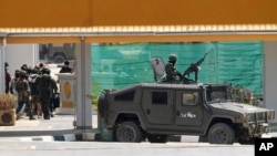 Thai soldiers provide security for Indonesian nationals being sent home after being forced to work at scam centers in eastern Myanmar in Mae Sot, Thailand on Feb. 27, 2025.