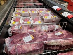 FILE - Meat products at a grocery store in Roslyn, Pa., June 15, 2021.