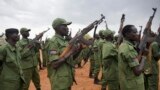 South Sudanese rebel soldiers raise their weapons at a military camp in the capital Juba, South Sudan, April 7, 2016. The rebels have set up camp at two designated sites in the capital as part of the process to secure the city for their leader Riek Machar's return.