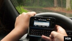 Texting while driving is ... (f/13, 1/50 sec, 48mm)