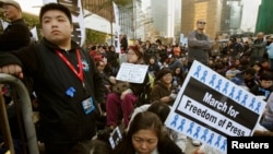 FILE - Protesters sit outside the office of Hong Kong's Chief Executive during a demonstration demanding for freedom of speech and press freedom in Hong Kong.