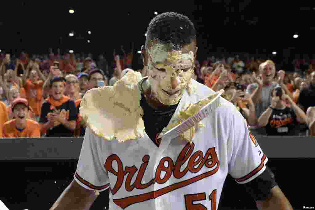 Aug 19, 2015; Baltimore, MD, USA; Baltimore Orioles center fielder Adam Jones (not pictured) pies left fielder Henry Urrutia (51) after his walk off home run during the ninth inning against the New York Mets at Oriole Park at Camden Yards. Baltimore Orioles defeated New York Mets 5-4. (Image Credit: Tommy Gilligan/USA TODAY Sports)