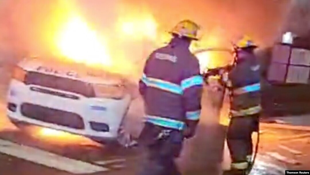 Police vehicle burns during protests after police shooting death of Wallace Jr. in Philadelphia, Pennsylvania