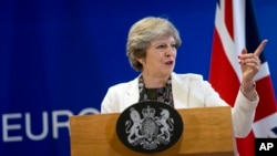 FILE - British Prime Minister Theresa May Theresa May speaks during a media conference at an EU summit in Brussels on Oct. 20, 2017.