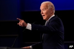 Democratic presidential candidate former Vice President Joe Biden gestures while speaking during the first presidential debate, Sept. 29, 2020, at Case Western University and Cleveland Clinic, in Cleveland, Ohio.