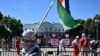 Pro-Palestinian demonstrators wave Palestinian flags as they rally near the White House in Washington on June 8, 2024, to protest Israel's actions in the Gaza Strip.
