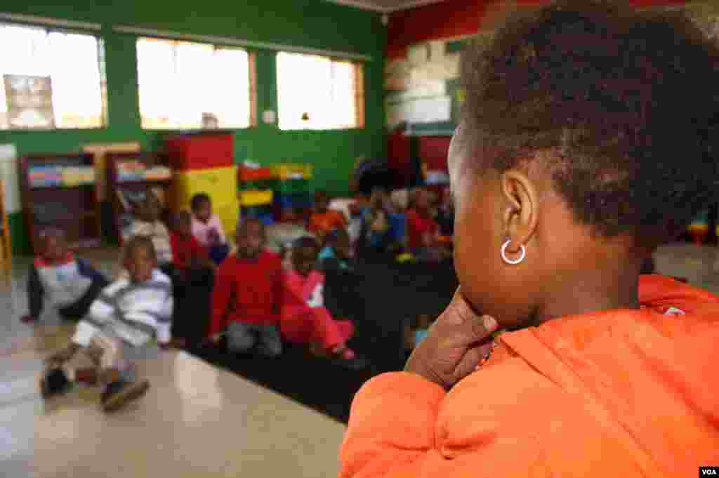 When the children gather to sing, Pekane fears they will be singing their last song in this poorly funded school that is a haven in a nation shadowed by infectious diseases. (Photo by Darren Taylor)