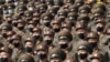 FILE - Soldiers wearing face masks to help curb the spread of the coronavirus rally in Pyongyang, North Korea, on Oct. 12, 2020. 