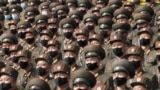 FILE - Soldiers wearing face masks to help curb the spread of the coronavirus rally in Pyongyang, North Korea, on Oct. 12, 2020. 