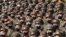 FILE - Soldiers wearing face masks to help curb the spread of the coronavirus rally in Pyongyang, North Korea, on Oct. 12, 2020. 