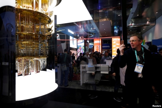 FILE - A man takes a photo of a model of the IBM Q System One quantum computer during the 2020 CES in Las Vegas, Nevada, U.S. January 7, 2020. (REUTERS/Steve Marcus/File Photo)