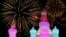 Fireworks light up the sky behind ice sculptures during the opening day of the Harbin International Ice and Snow Festival in the northern city of Harbin, Heilongjiang province, China.