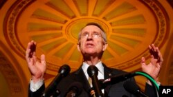 FILE - Senate Majority Leader Harry Reid of Nevada gestures during a news conference on Capitol Hill in Washington, on June 26, 2007.