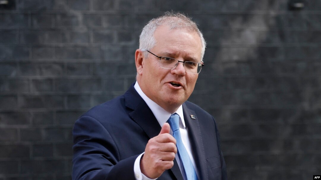 FILE - Australia's Prime Minister Scott Morrison gestures as he leaves 10 Downing street in central London on June 15, 2021.