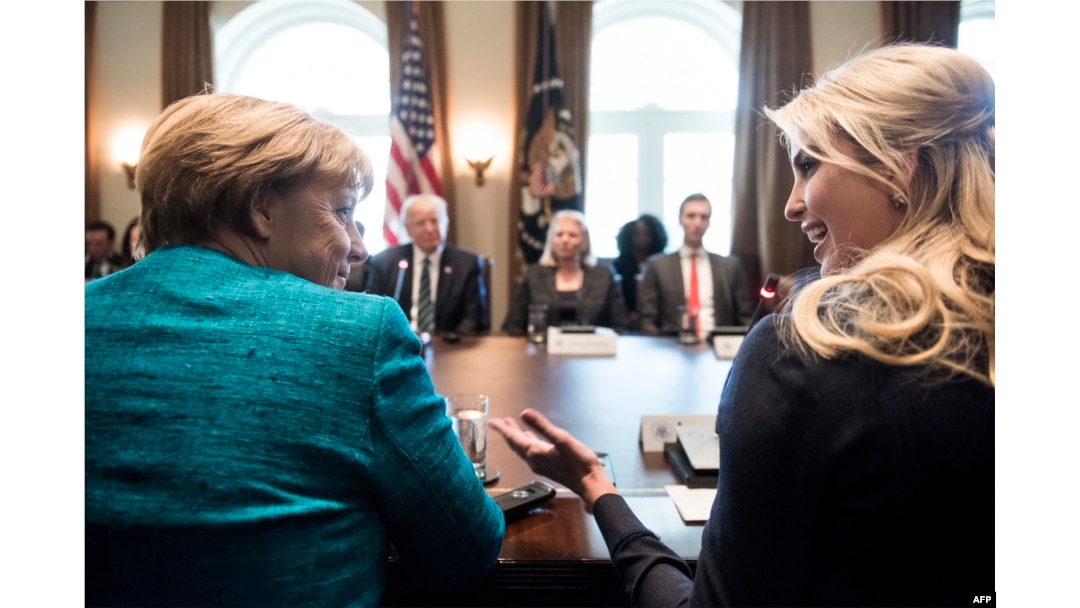 Germany's Chancellor Angela Merkel (L) and Ivanka Trump (R) talk before a meeting with US President Donald Trump and business leaders in the Cabinet Room of the White House, March 17, 2017 in Washington, D.C.