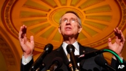 FILE - Senate Majority Leader Harry Reid of Nev., gestures during a news conference on Capitol Hill in Washington, on June 26, 2007.