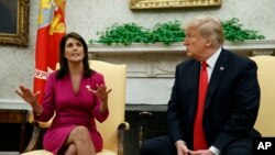FILE - President Donald Trump meets with outgoing U.S. Ambassador to the United Nations Nikki Haley in the Oval Office of the White House, Tuesday, Oct. 9, 2018, in Washington.