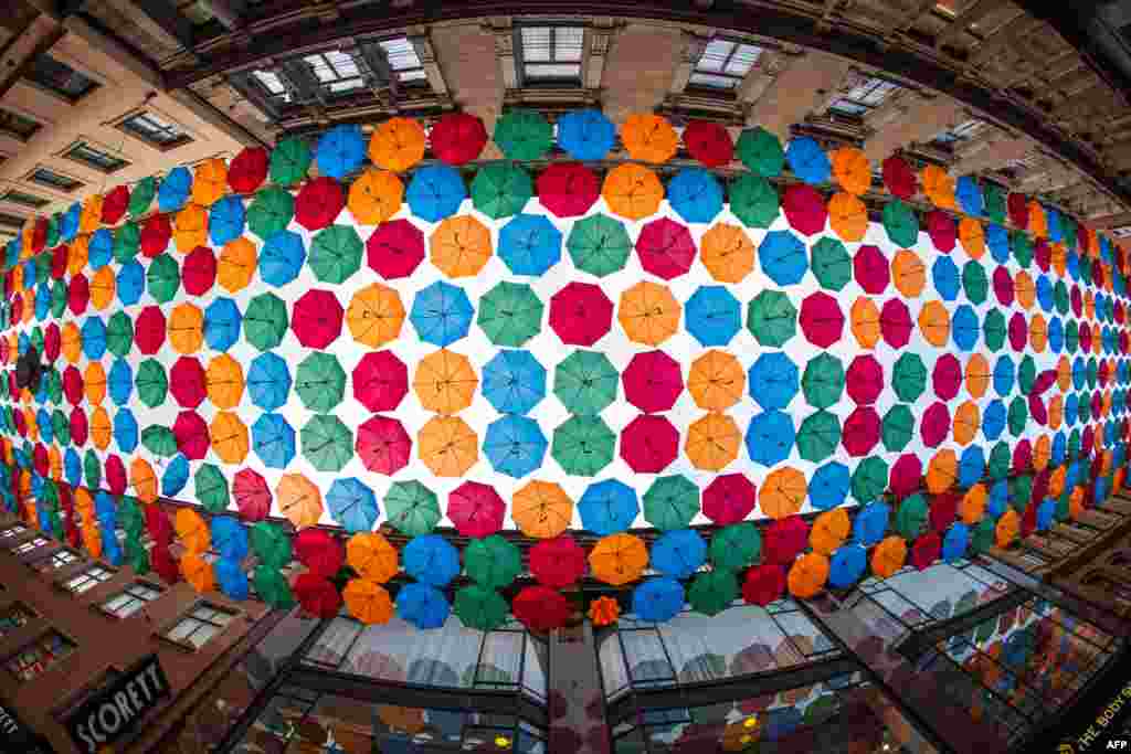 The Umbrella Project, an art installation of colorful umbrellas, is pictured over Drottninggatan shopping street in central Stockholm, Oct. 8, 2020.