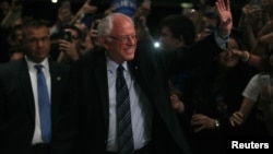 Democratic U.S. presidential candidate Senator Bernie Sanders arrives to speak to supporters on the night of the Michigan, Mississippi and other primaries, at his campaign rally in Miami, Florida, March 8, 2016.