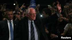 Democratic U.S. presidential candidate Senator Bernie Sanders arrives to speak to supporters on the night of the Michigan, Mississippi and other primaries at his campaign rally in Miami, Florida, March 8, 2016.