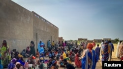 FILE - Sudanese refugees gather as Doctors Without Borders (MSF) teams assist the war wounded from West Darfur, Sudan, in Adre hospital, Chad June 16, 2023 in this handout image.