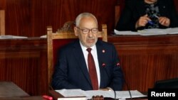 FILE - Rached Ghannouchi, leader of Tunisia's moderate Islamist Ennahda party, attends the parliament's opening, in Tunis, Nov. 13, 2019. 