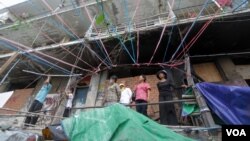 FILE PHOTO - Residents of Borei Keila community watched on as their building is being torn down, Phnom Penh, Cambodia. (Leng Len/VOA Khmer)