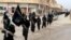 FILE - Fighters from the al-Qaida linked Islamic State of Iraq and the Levant (ISIL) marching in Raqqa, Syria.