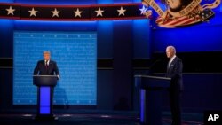 President Donald Trump and Democratic presidential candidate former Vice President Joe Biden during the first presidential debate Tuesday, Sept. 29, 2020, at Case Western University and Cleveland Clinic, in Cleveland, Ohio. (AP Photo/Julio Cortez)