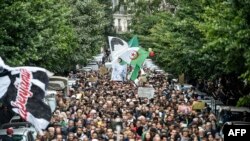  People are seen gathered for a mass anti-government protest in the center of the Algerian capital Algiers, Dec. 17, 2019.