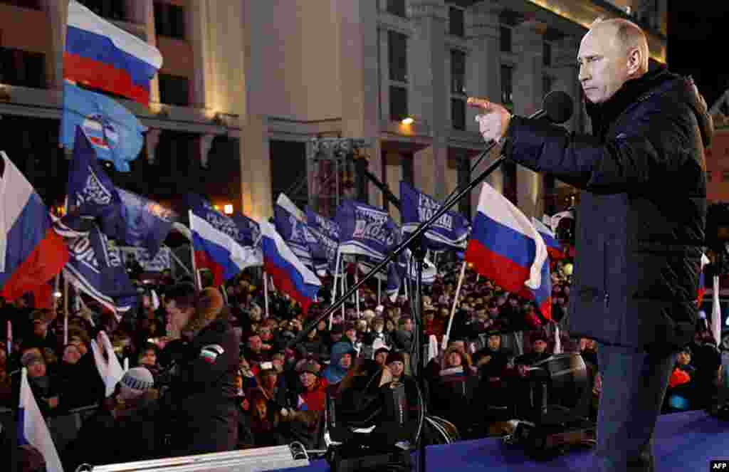 Russian Prime Minister Vladimir Putin, who claimed victory in Russia's presidential election, speaks at a rally of his supporters outside the Kremlin, in Moscow, Russia, March 4, 2012. (AP)