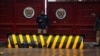 A policeman stands guard outside the Khyber Pakhtunkhwa House, where negotiations took place between Pakistani government officials and Taliban negotiators, in Islamabad on Feb. 6, 2014. 