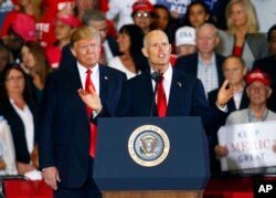 El presidente Donald Trump respadó durante la campaña al exgobernador de Florida, Rick Scott, en su carrera al Senado.